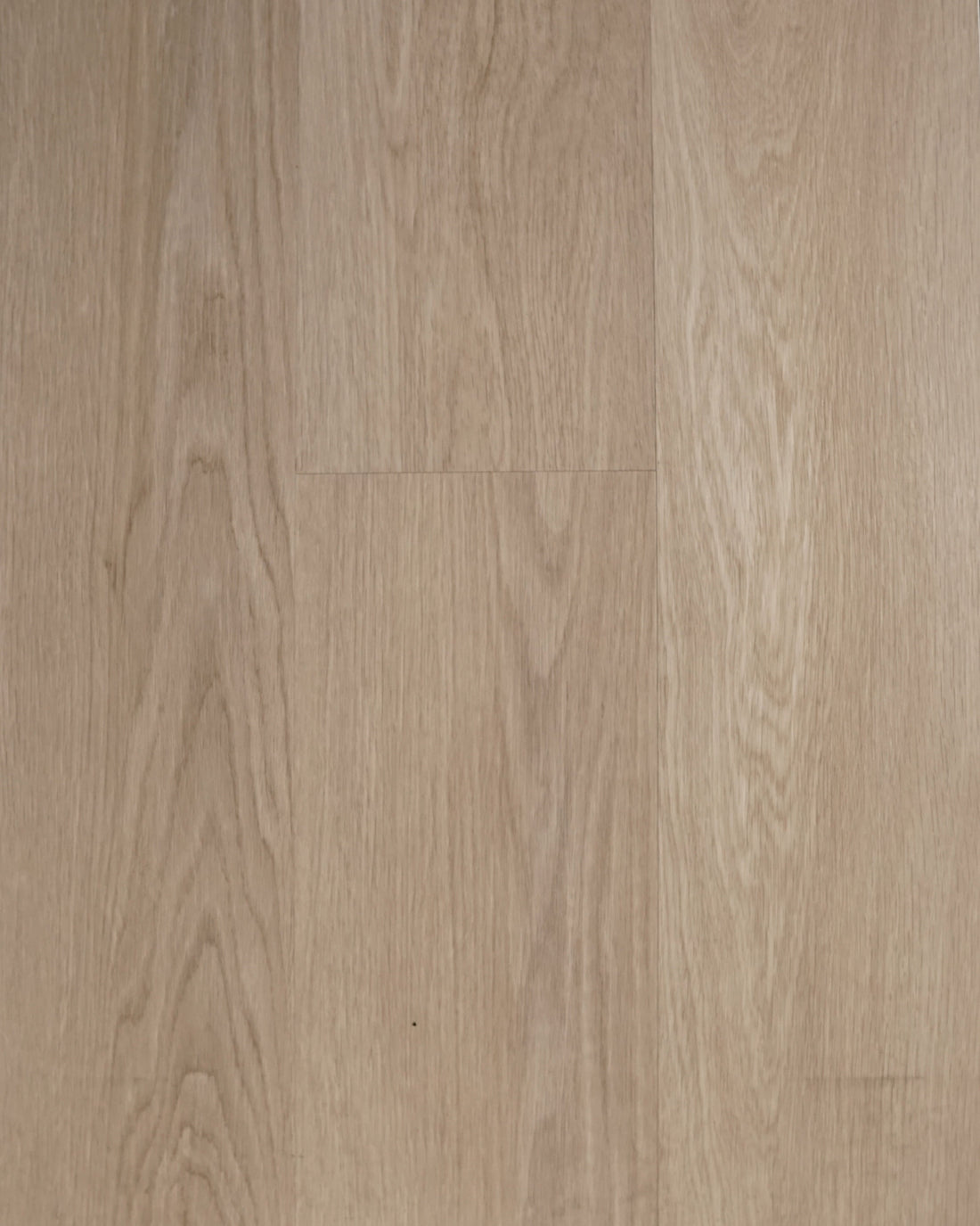 Riche Flooring Heavy-Duty Driftwood Mist SPC vinyl planks with a pale greige oak-look woodgrain