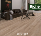 Sandy Driftwood laminate from the Riche Toronto Collection, a light beige plank floor in a living room
