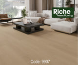 Desert Sand Riche Toronto Collection 12mm EIR laminate in a bright living room with light beige wood-look planks